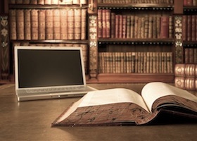 Laptop in classic library with books in background series